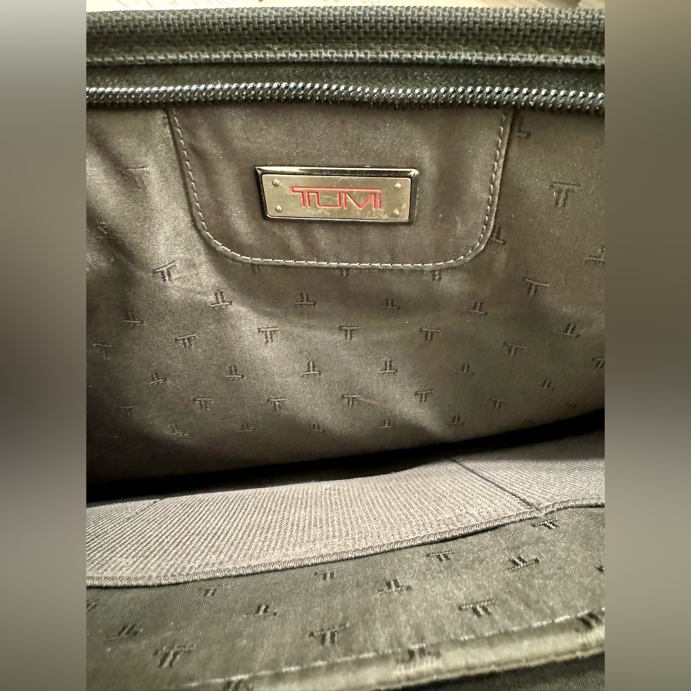 TUMI black laptop carrier bag. It has wallet inside.  It has various - Picture 12 of 15